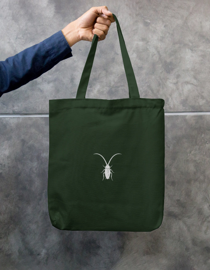 Back Eco-friendly bottle green canvas tote bag with a secure zipper closure by Roach Resistance.