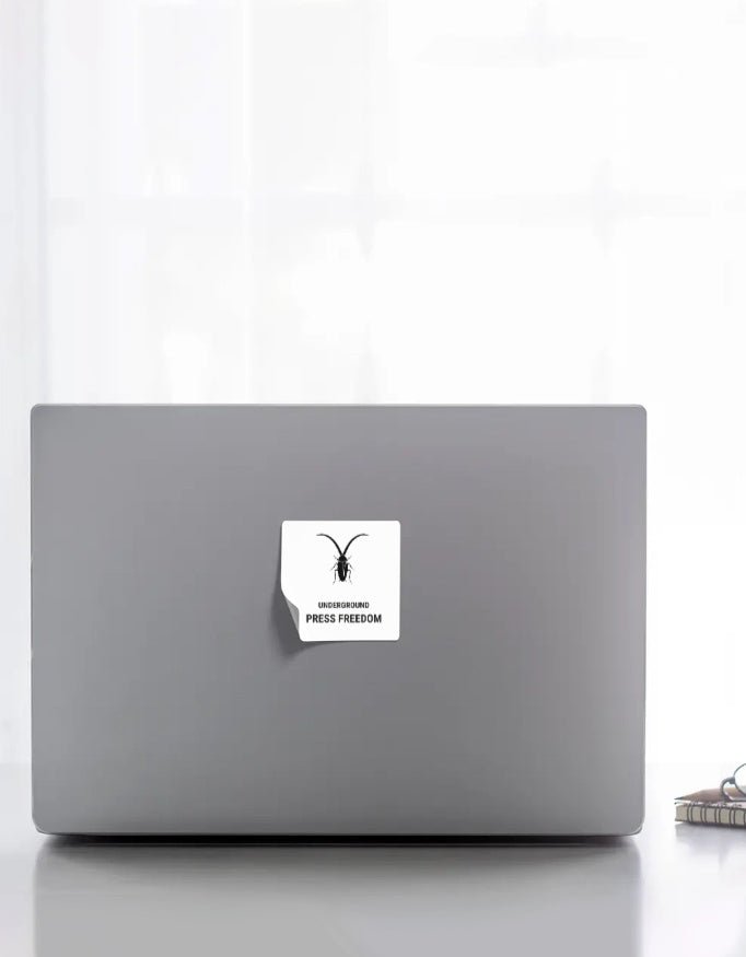 Front Roach Resistance Press Freedom die-cut sticker styled on a laptop , showcasing its outdoor durability.