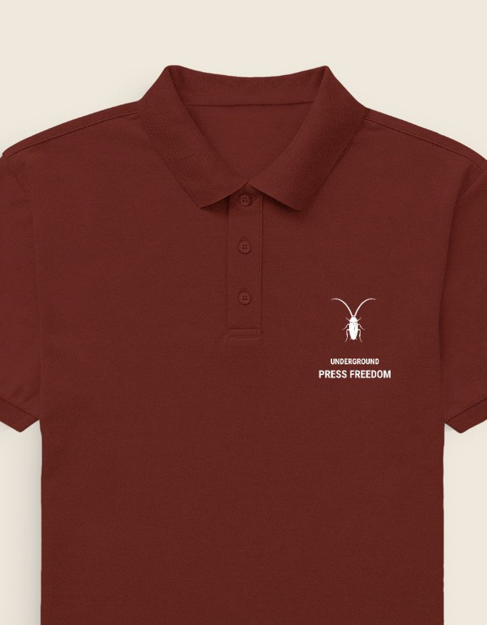 Left Crisp front view of the premium brick red textured cotton polo by Roach Resistance from the Press Freedom drop.