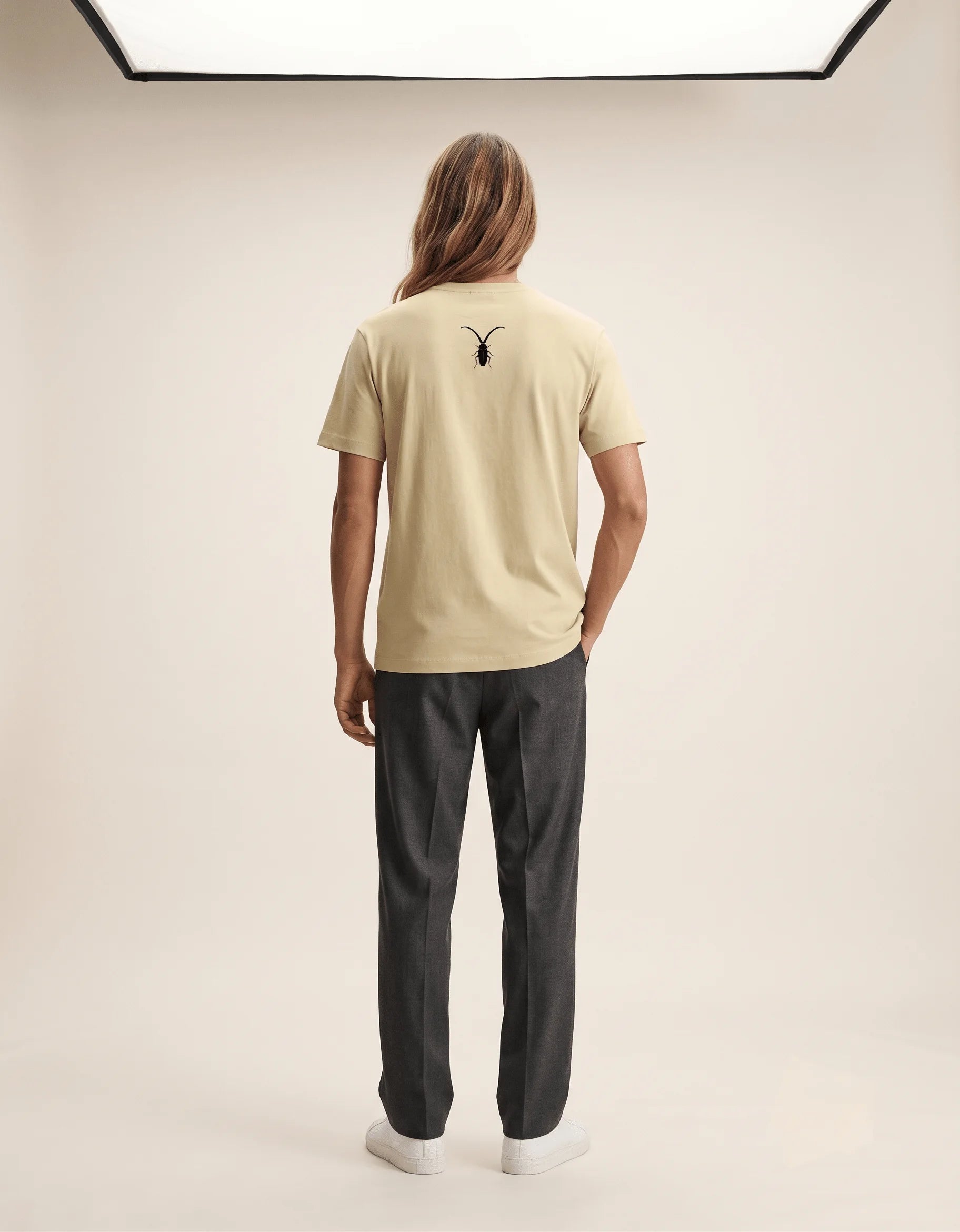 Premium unisex warm beige t-shirt from Roach Resistance's Press Freedom collection highlighting regular fit draping and fine Supima cotton weave.back look.