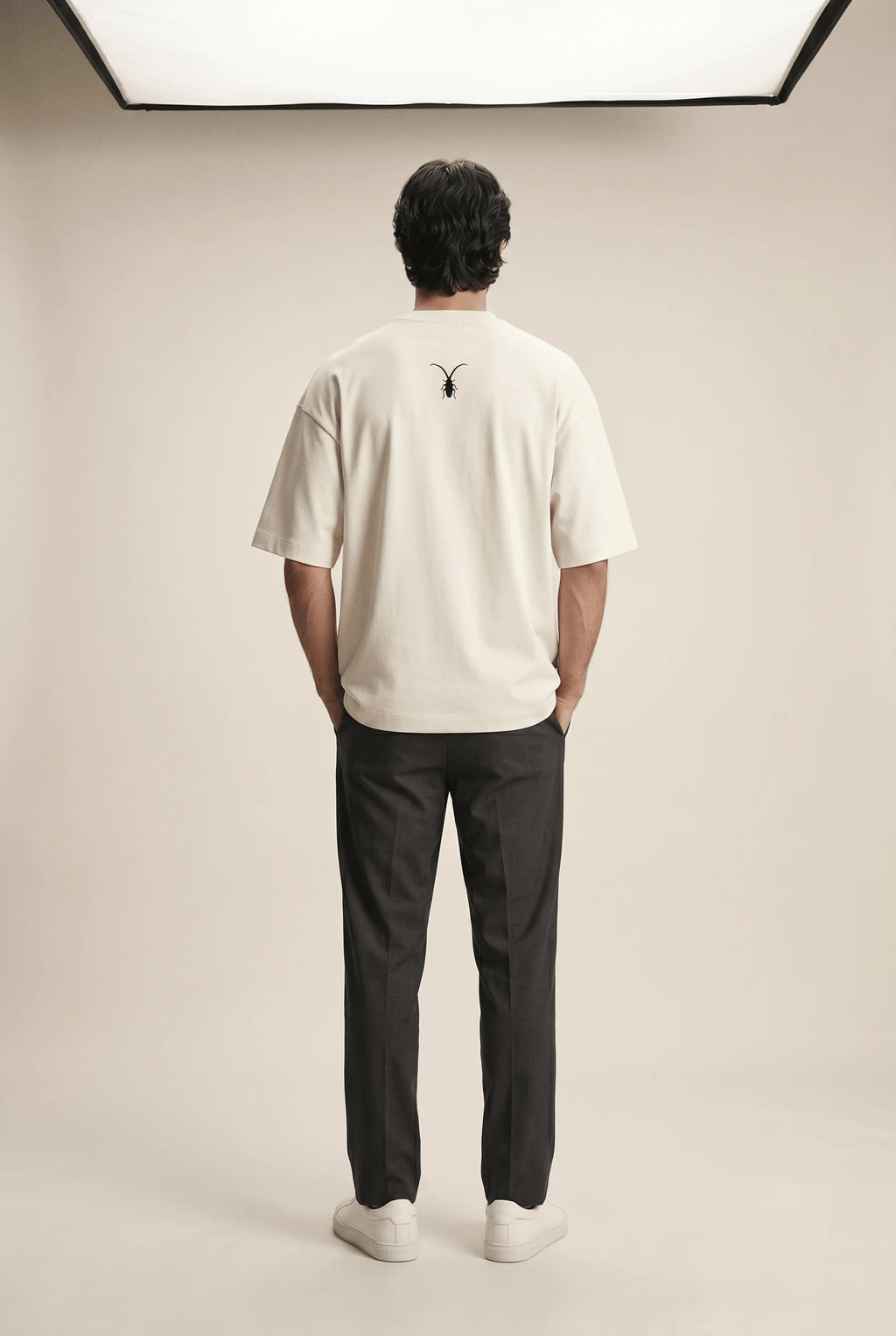 Premium unisex warm beige t-shirt from Roach Resistance's Press Freedom collection highlighting regular fit draping and fine Supima cotton weave.back look.