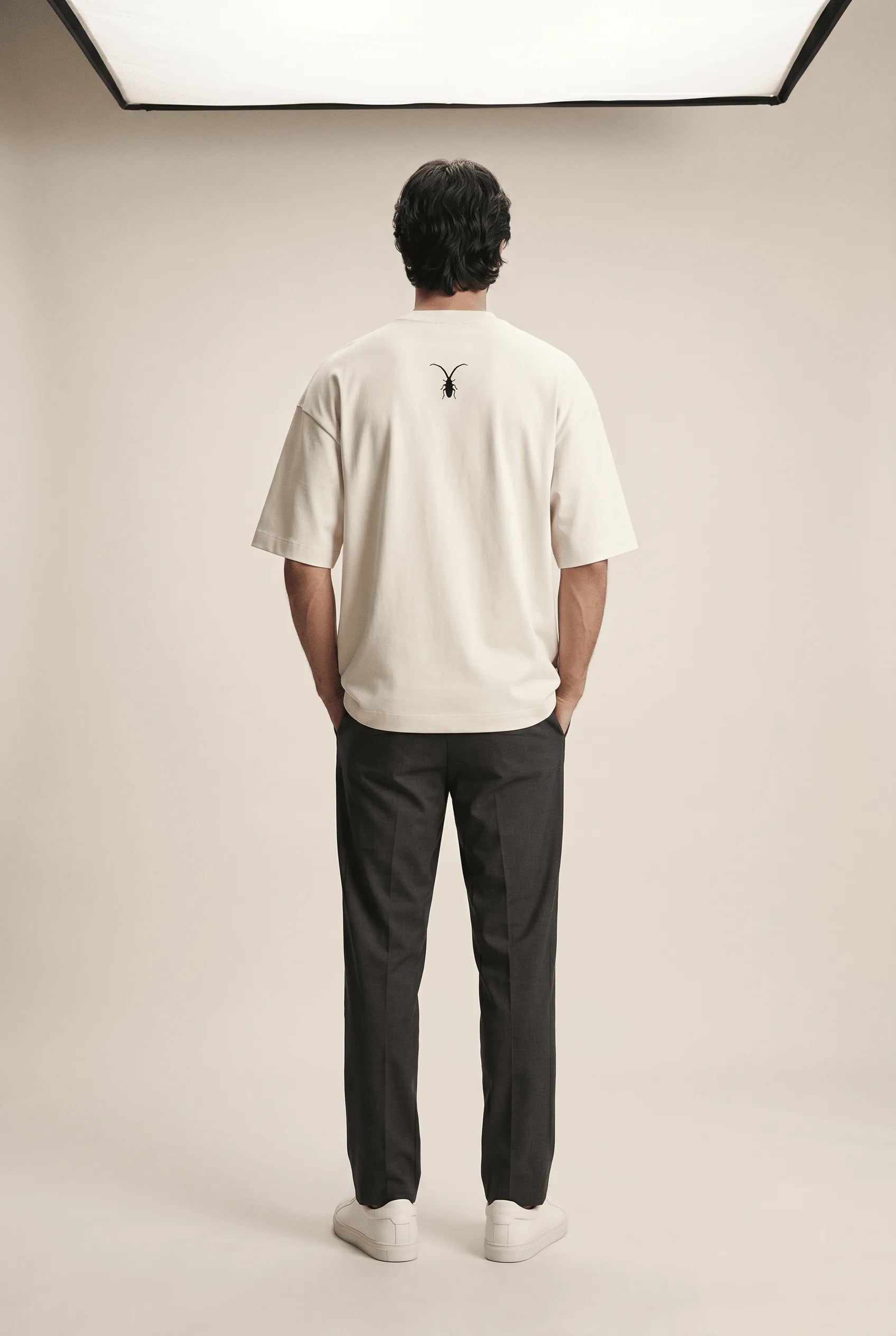 Premium unisex warm beige t-shirt from Roach Resistance's Press Freedom collection highlighting regular fit draping and fine Supima cotton weave.back look.