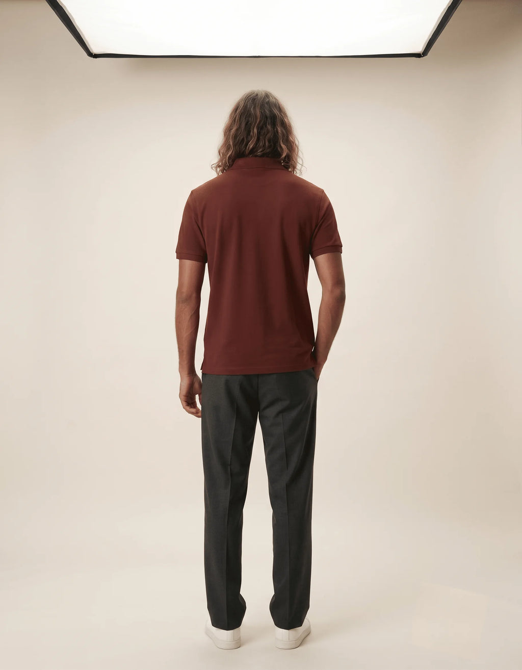 Men's premium brick red polo shirt featuring a structured collar and textured 220GSM cotton by Roach Resistance from the Press Freedom drop.