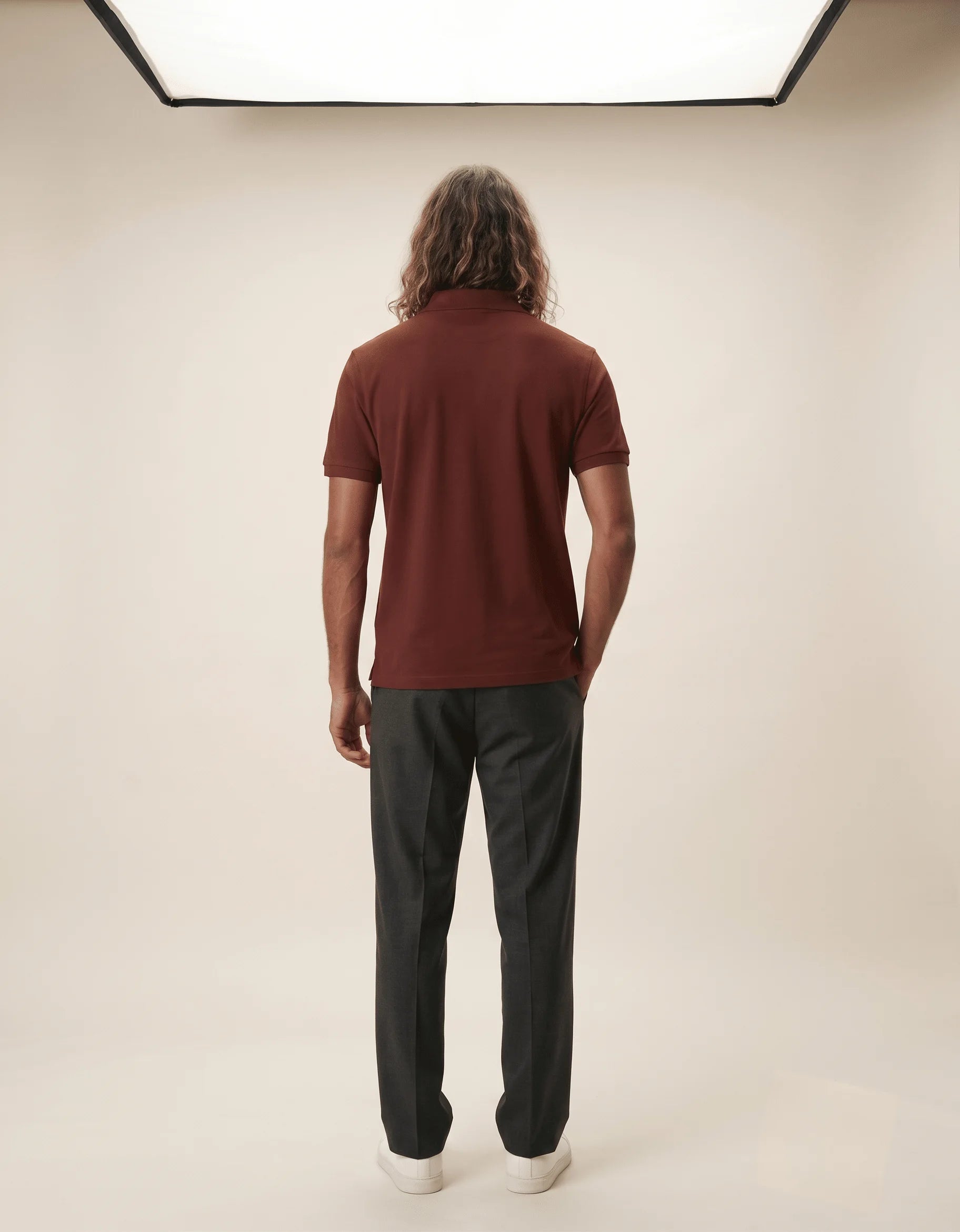Men's premium brick red polo shirt featuring a structured collar and textured 220GSM cotton by Roach Resistance from the Press Freedom drop.