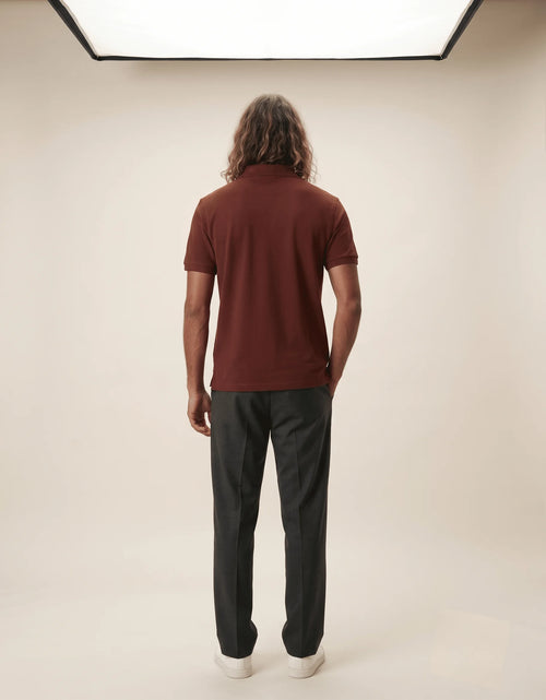 Men's premium brick red polo shirt featuring a structured collar and textured 220GSM cotton by Roach Resistance from the Press Freedom drop.