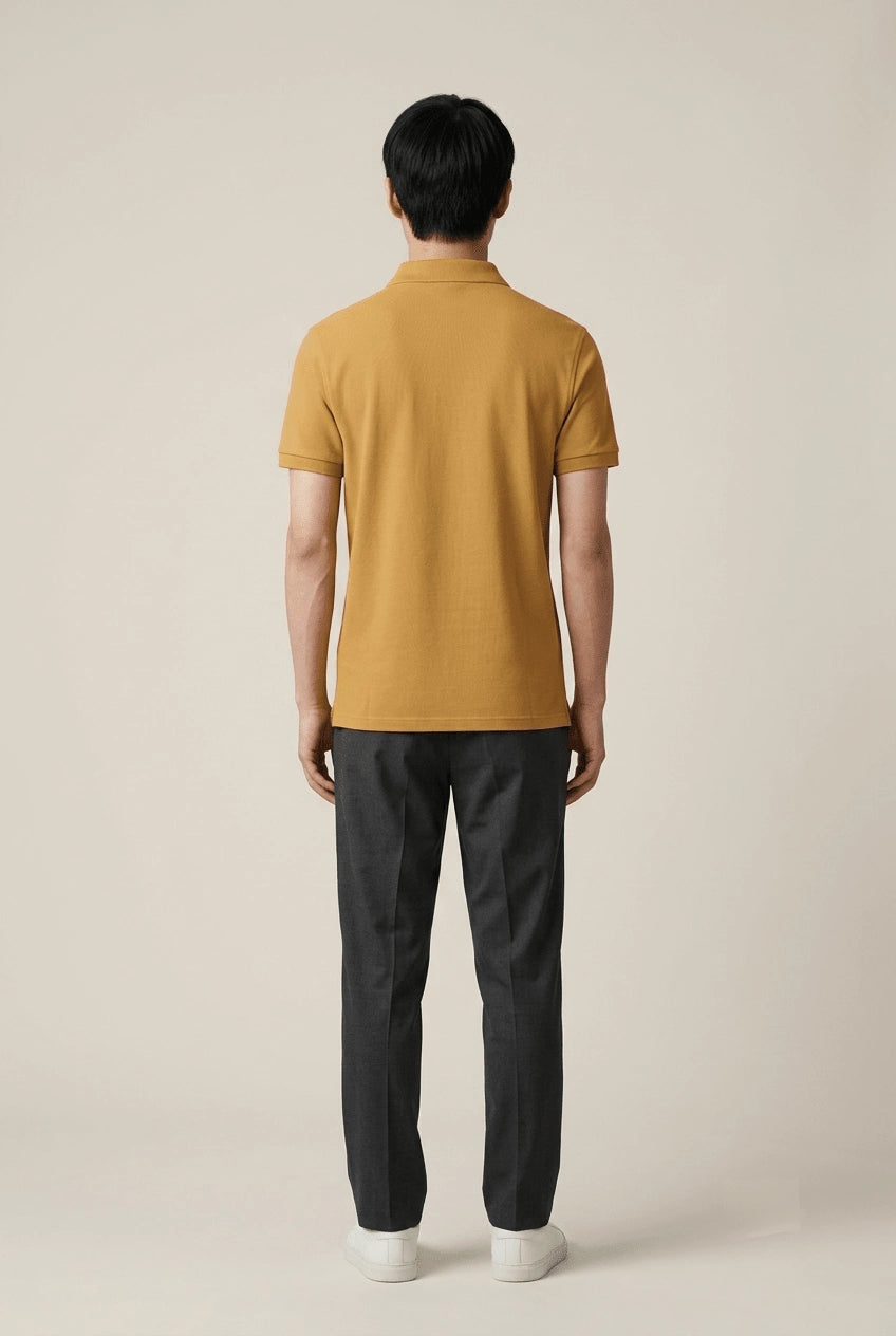 Men's mustard yellow cotton polo shirt from the Roach Resistance Press Freedom capsule.