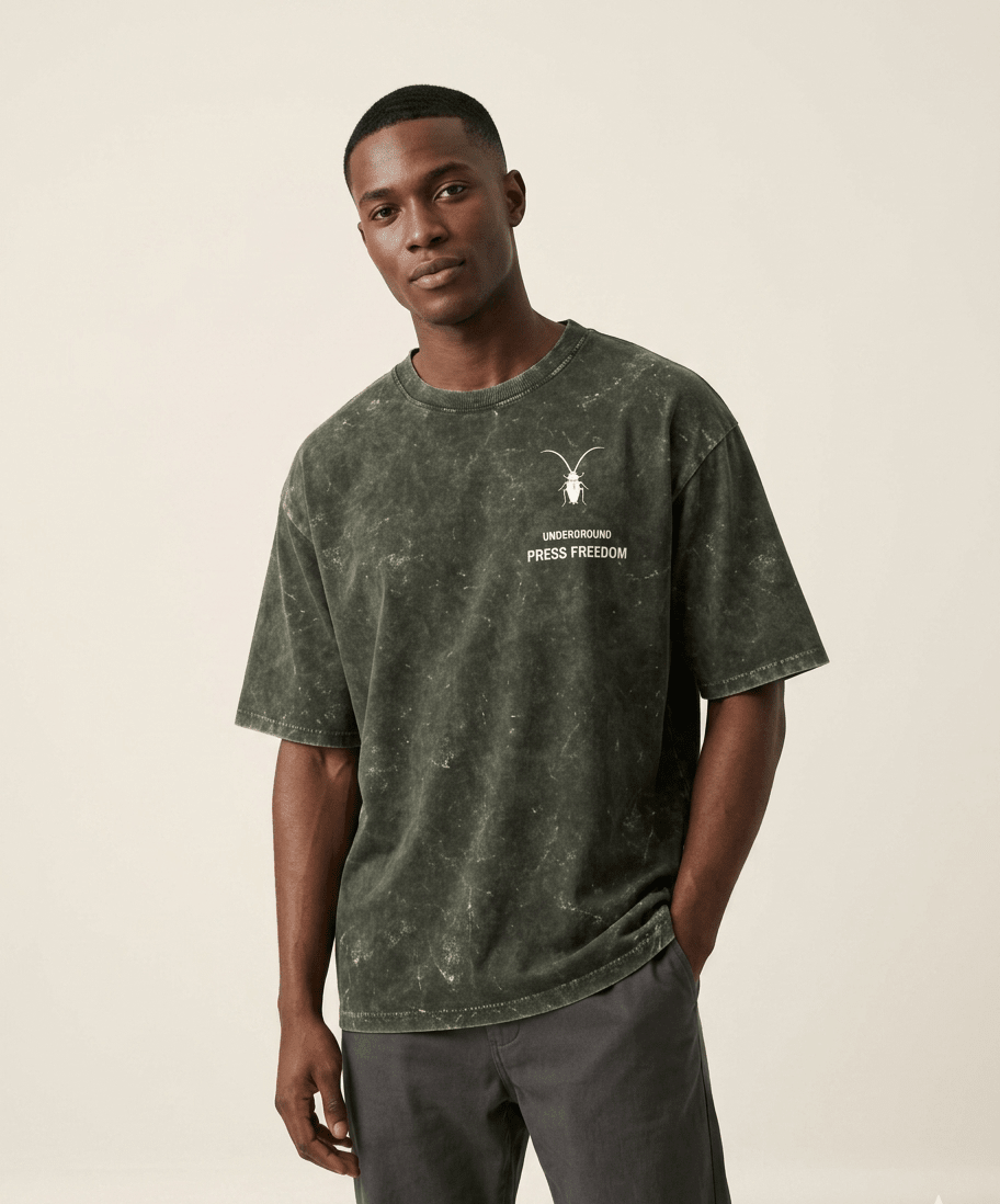 Premium regular fit unisex olive green acid-washed t-shirt by Roach Resistance from the Press Freedom capsule collection.