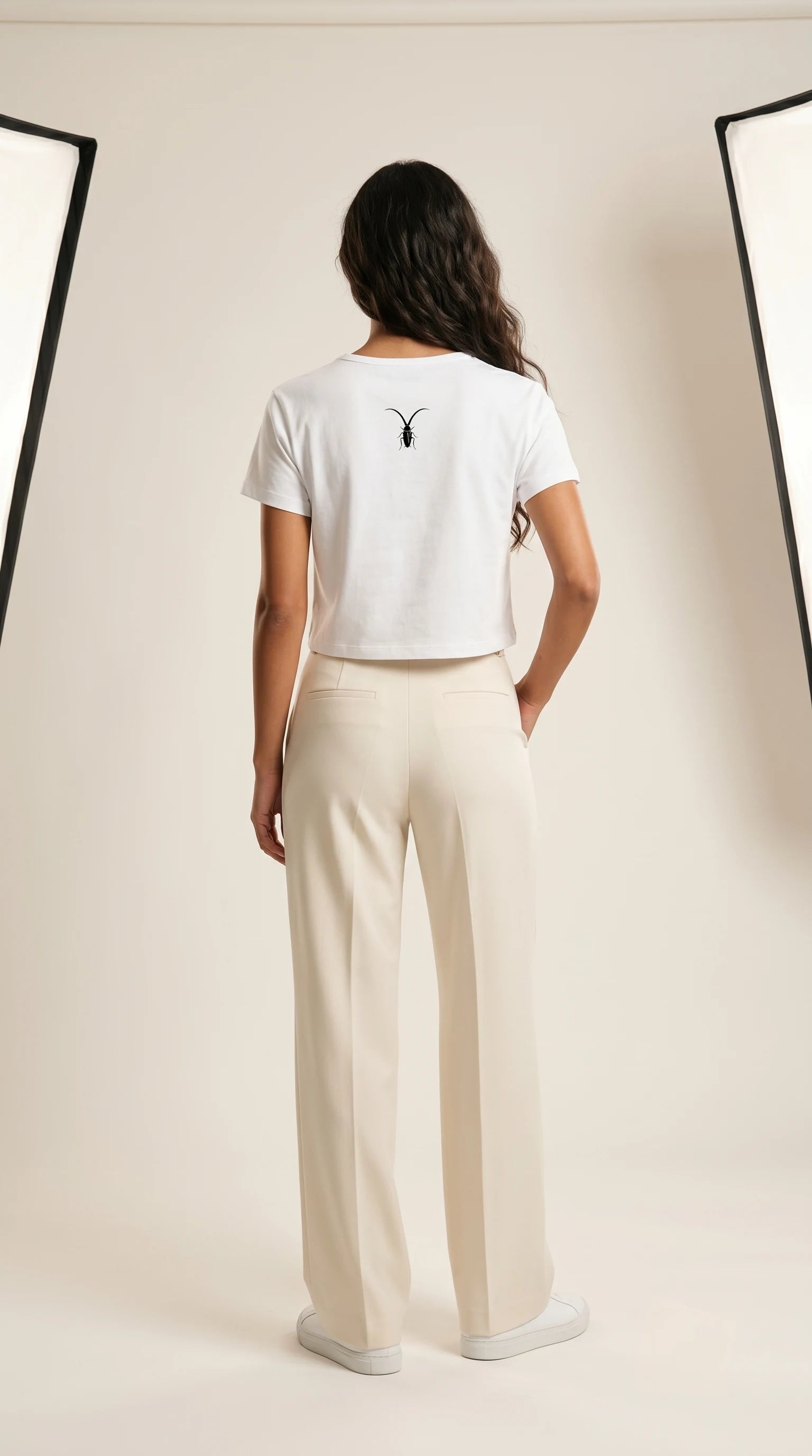 Back view of the premium 240GSM white cropped baby tee from the Roach Resistance Press Freedom collection.