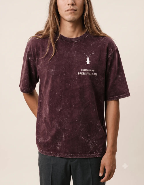 Luxury streetwear campaign showcasing the Roach Resistance 240GSM heavyweight acid-washed cotton t-shirts. close-up 