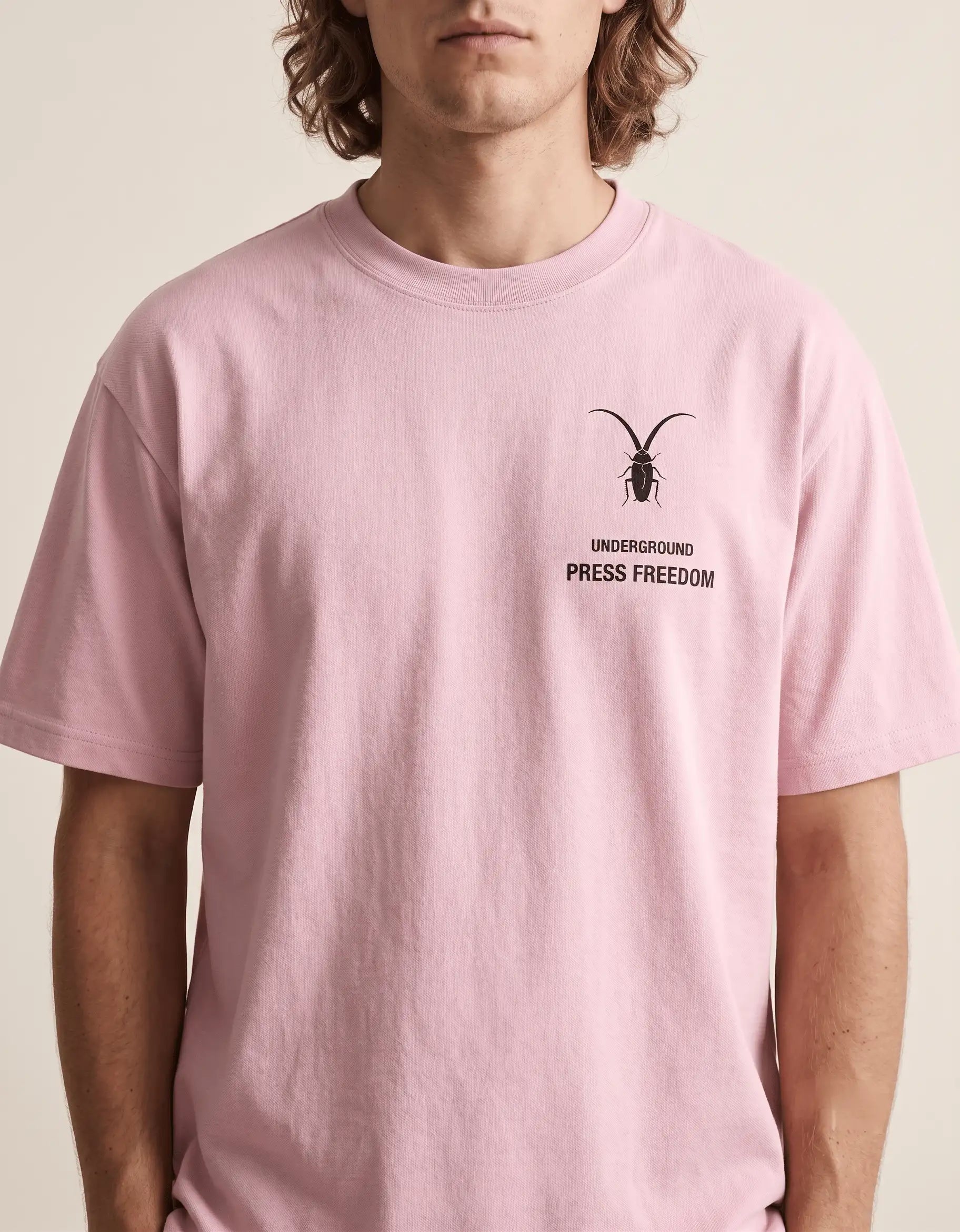  details Front view of the Roach Resistance Press Freedom light baby pink unisex stretch t-shirt, highlighting the clean, structured cotton-elastane fit.
