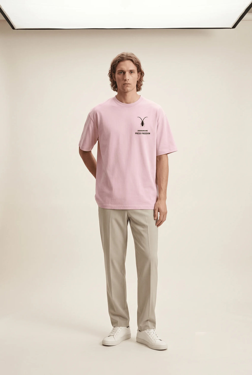 Front view of the Roach Resistance Press Freedom light baby pink unisex stretch t-shirt, highlighting the clean, structured cotton-elastane fit.