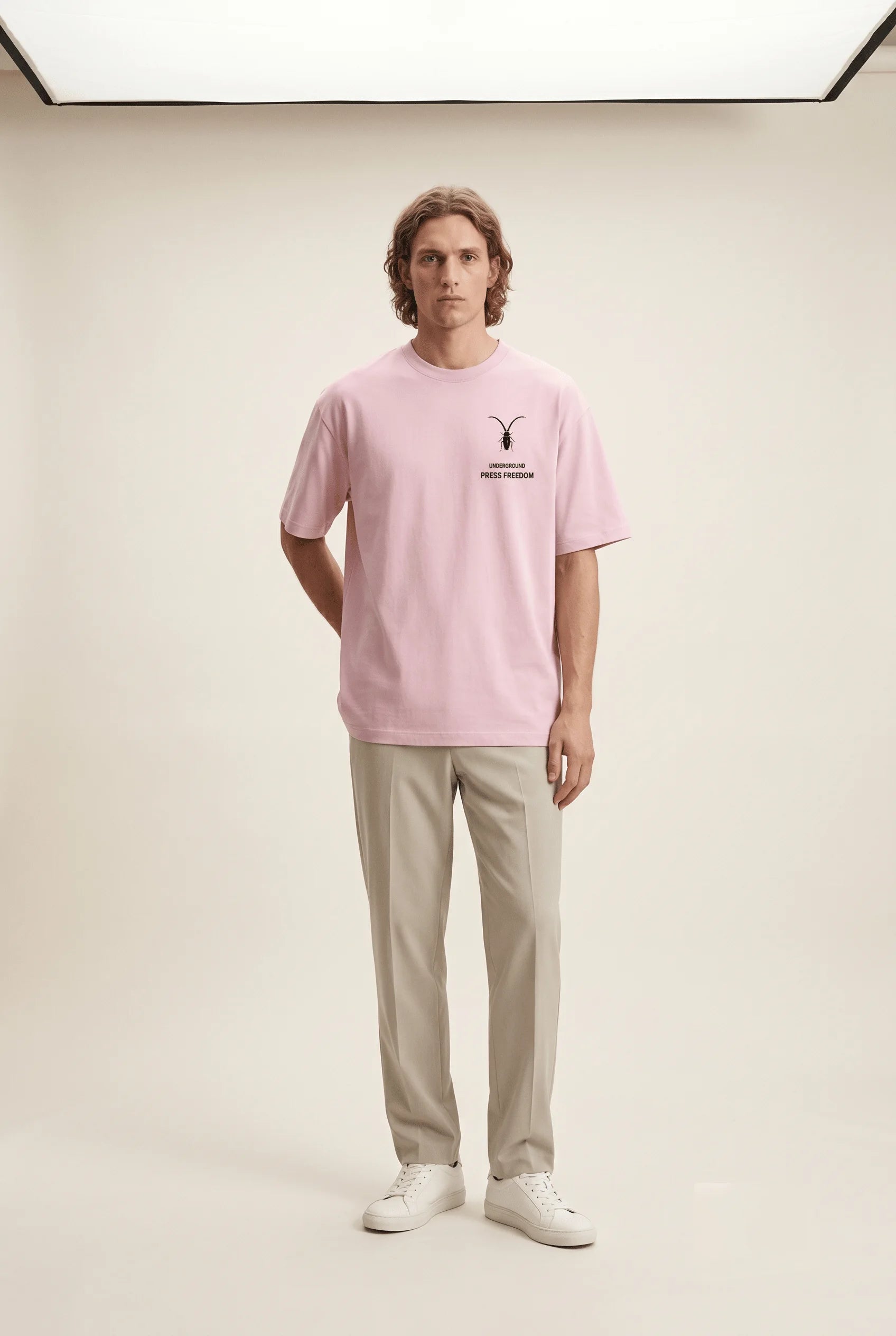 Front view of the Roach Resistance Press Freedom light baby pink unisex stretch t-shirt, highlighting the clean, structured cotton-elastane fit.