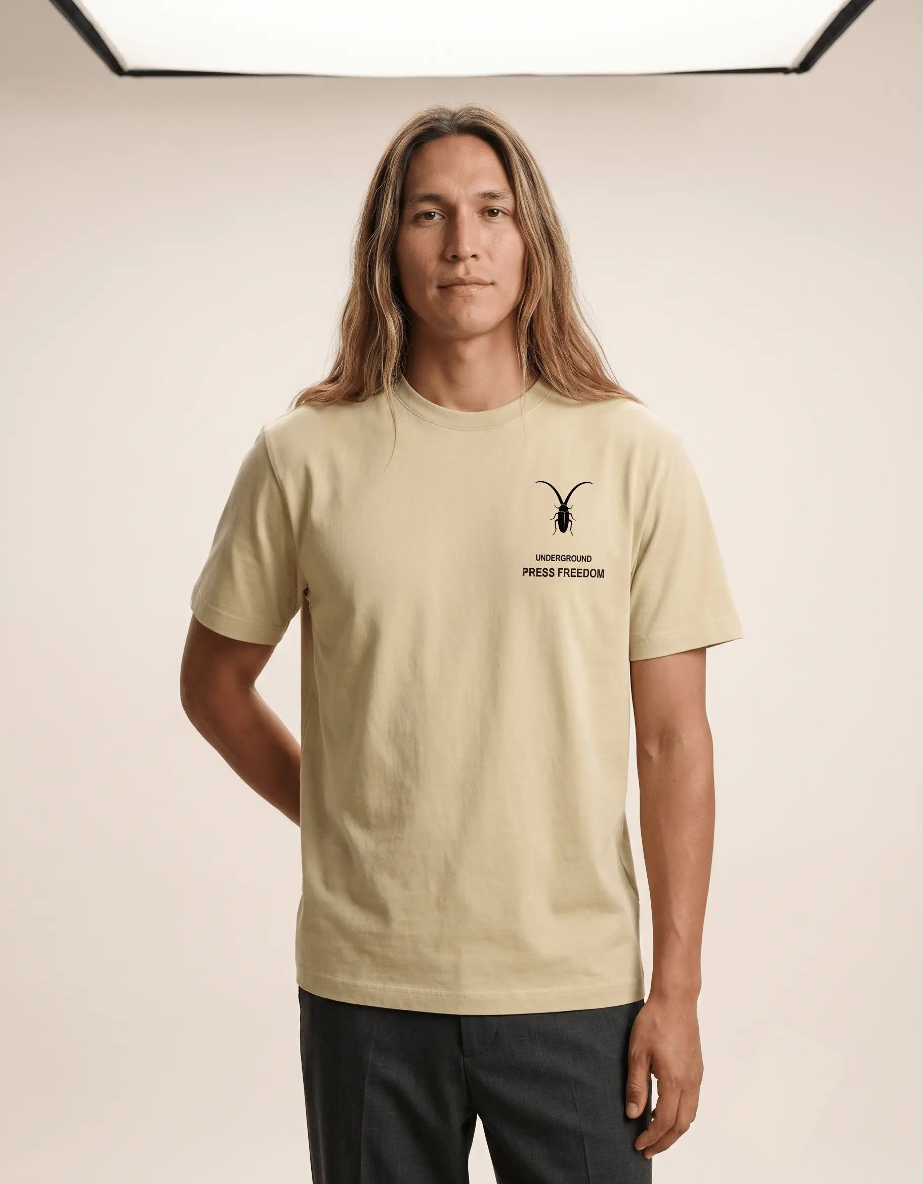Premium unisex warm beige t-shirt from Roach Resistance's Press Freedom collection highlighting regular fit draping and fine Supima cotton weave.