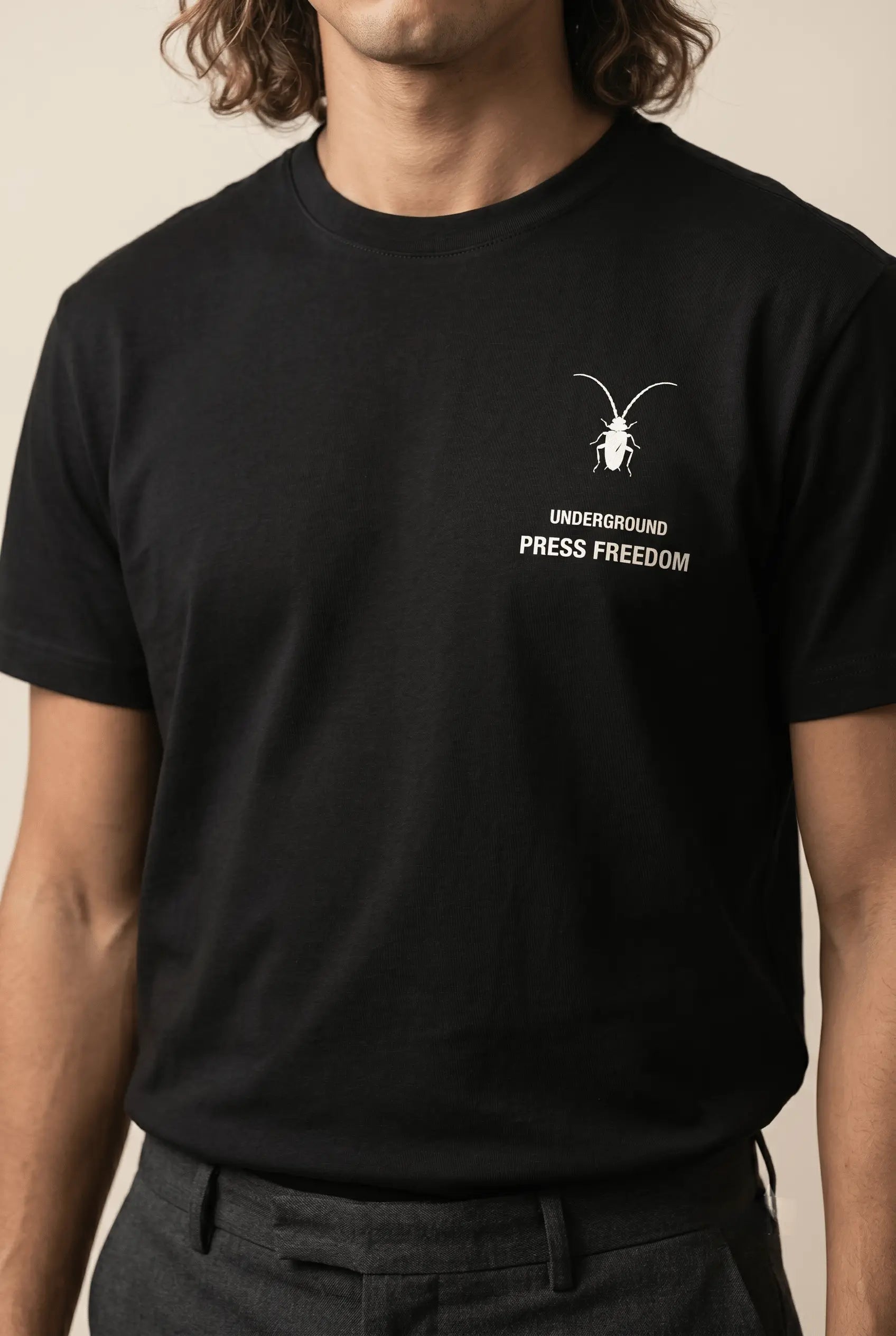 Premium unisex black t-shirt by Roach Resistance from the Press Freedom collection, showcasing high-end Supima cotton texture.