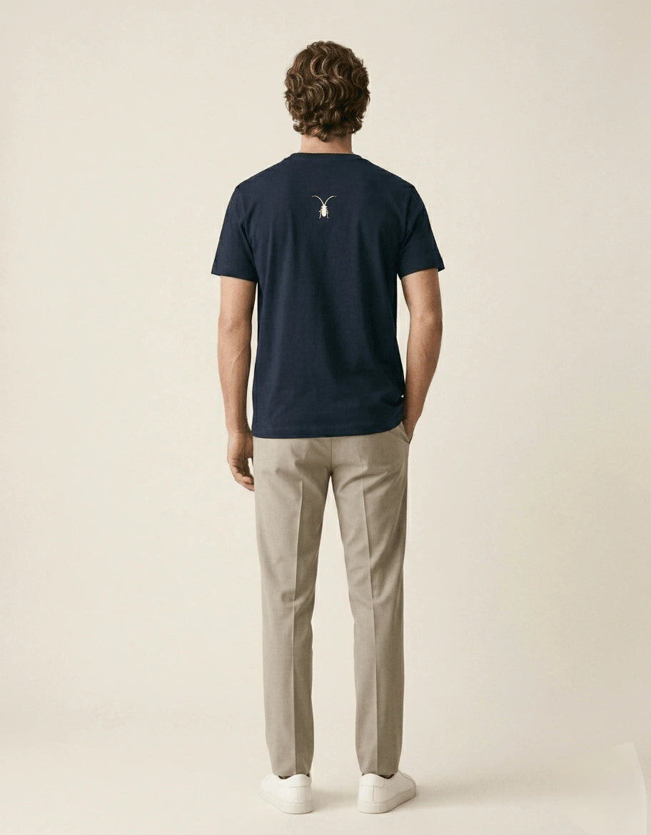 Clean studio backshot of a classic Roach Resistance unisex navy blue regular fit t-shirt from the Press Freedom collection.