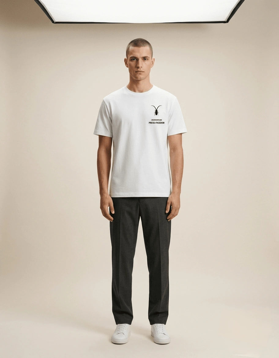 Studio display of a pristine white luxury unisex t-shirt in regular fit Supima cotton from the Roach Resistance Press Freedom collection. full shot