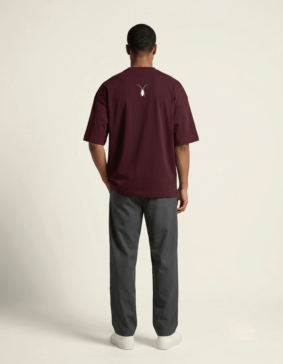 Premium maroon unisex oversized terry-knit t-shirt by Roach Resistance, featuring a relaxed drop-shoulder fit. back look