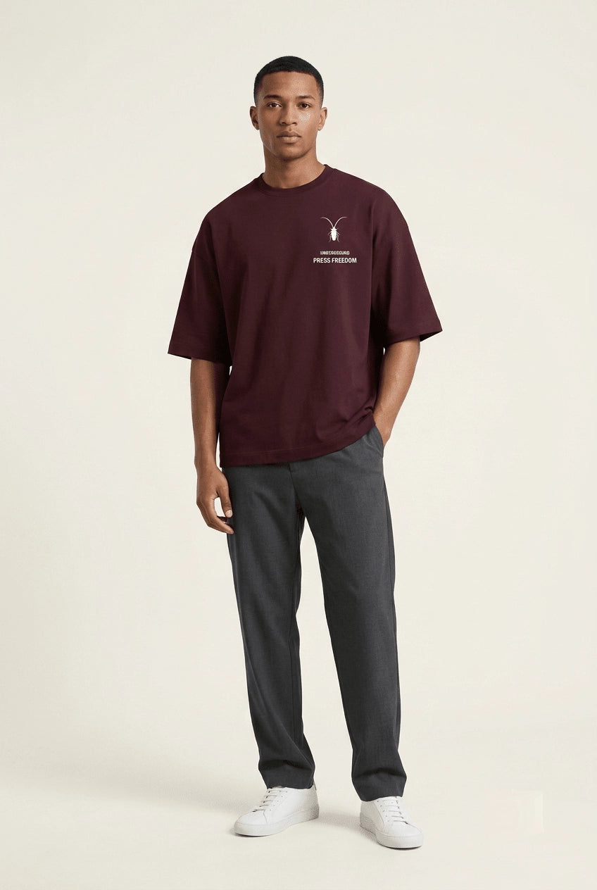 Premium maroon unisex oversized terry-knit t-shirt by Roach Resistance, featuring a relaxed drop-shoulder fit.