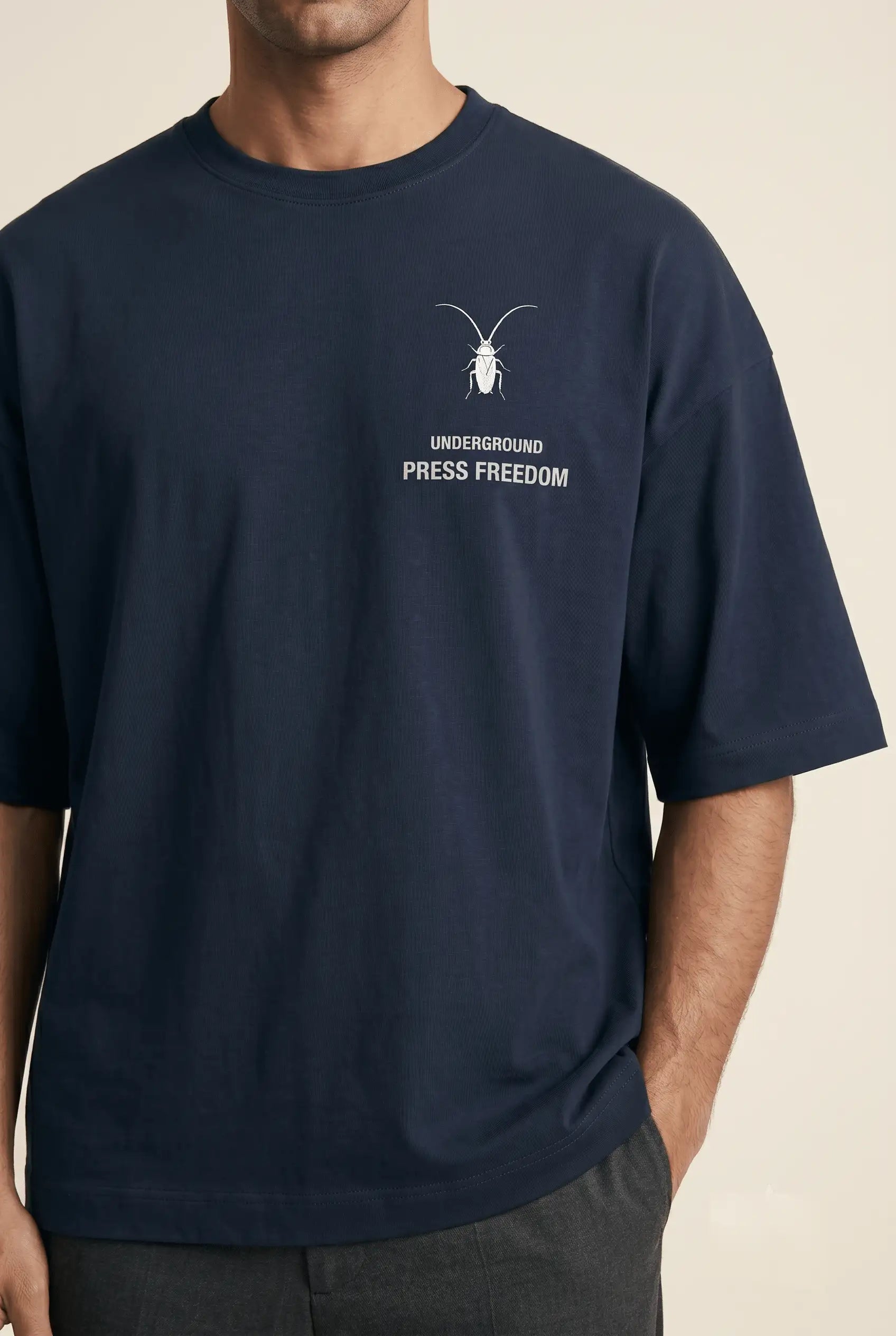 Clean studio  close-up shot of a heavy 260GSM navy blue oversized terry-knit tee from the Roach Resistance Press Freedom drop.