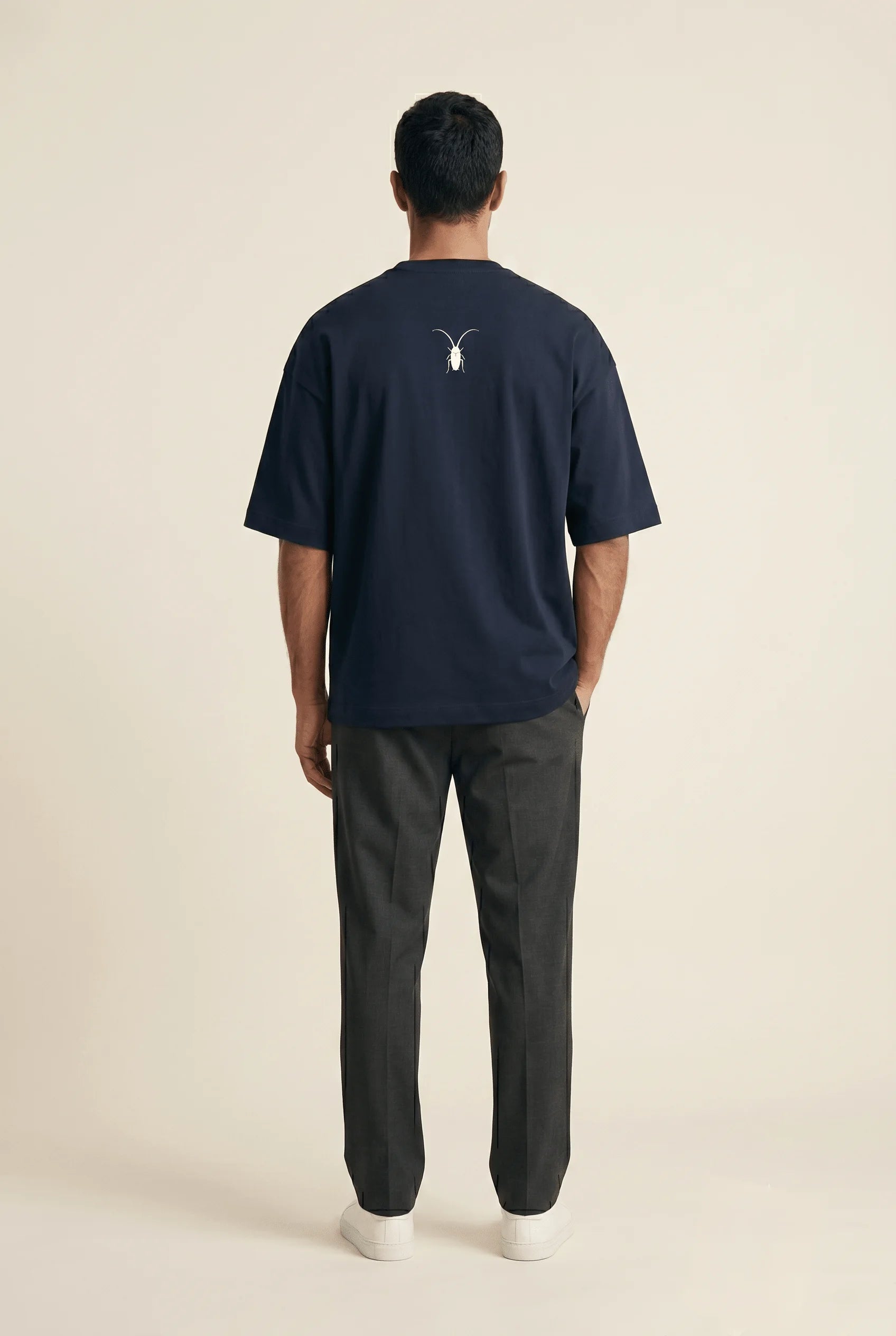 Clean studio back look shot of a heavy 260GSM navy blue oversized terry-knit tee from the Roach Resistance Press Freedom drop.