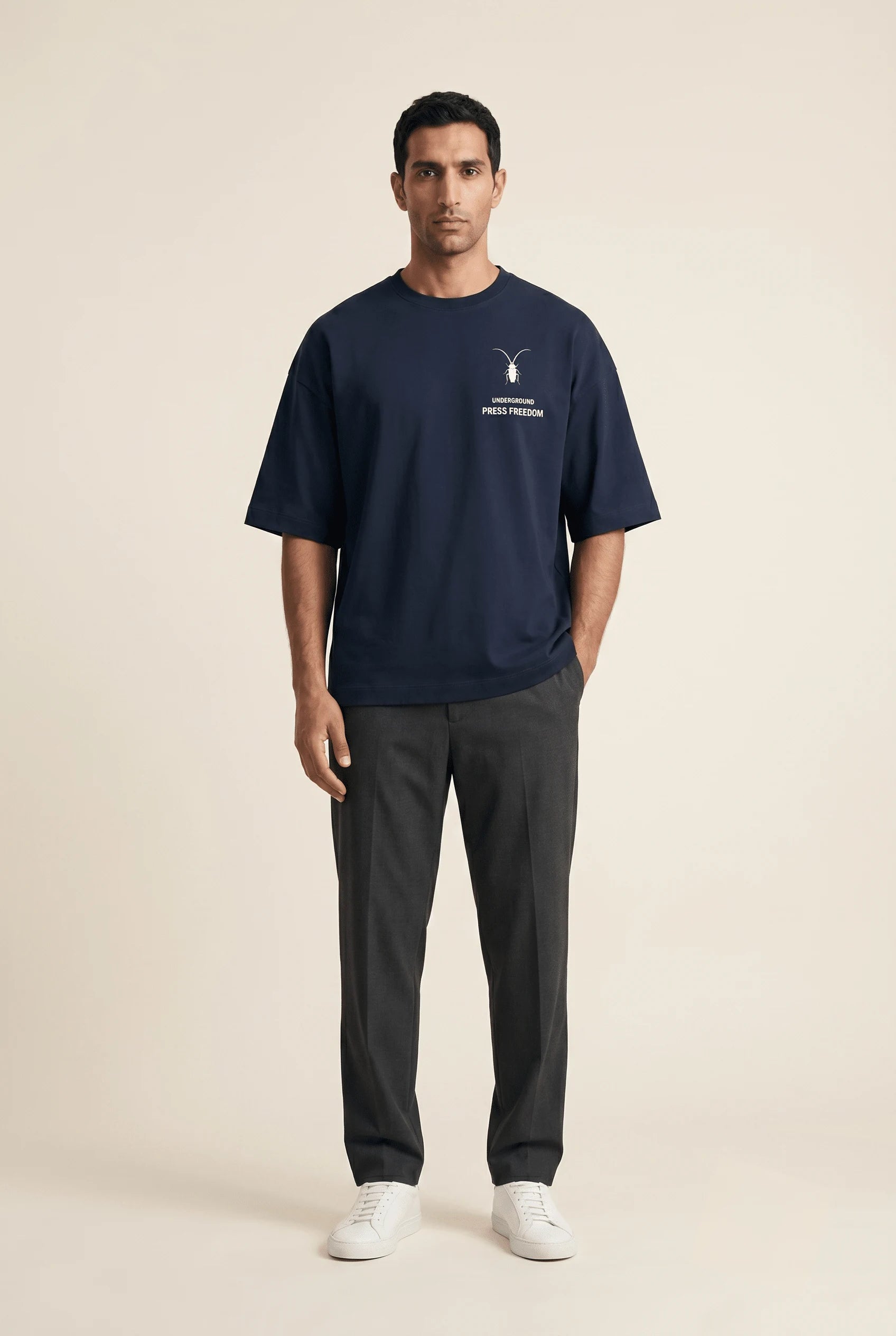 Clean studio shot of a heavy navy blue oversized terry-knit tee from the Roach Resistance Press Freedom drop.