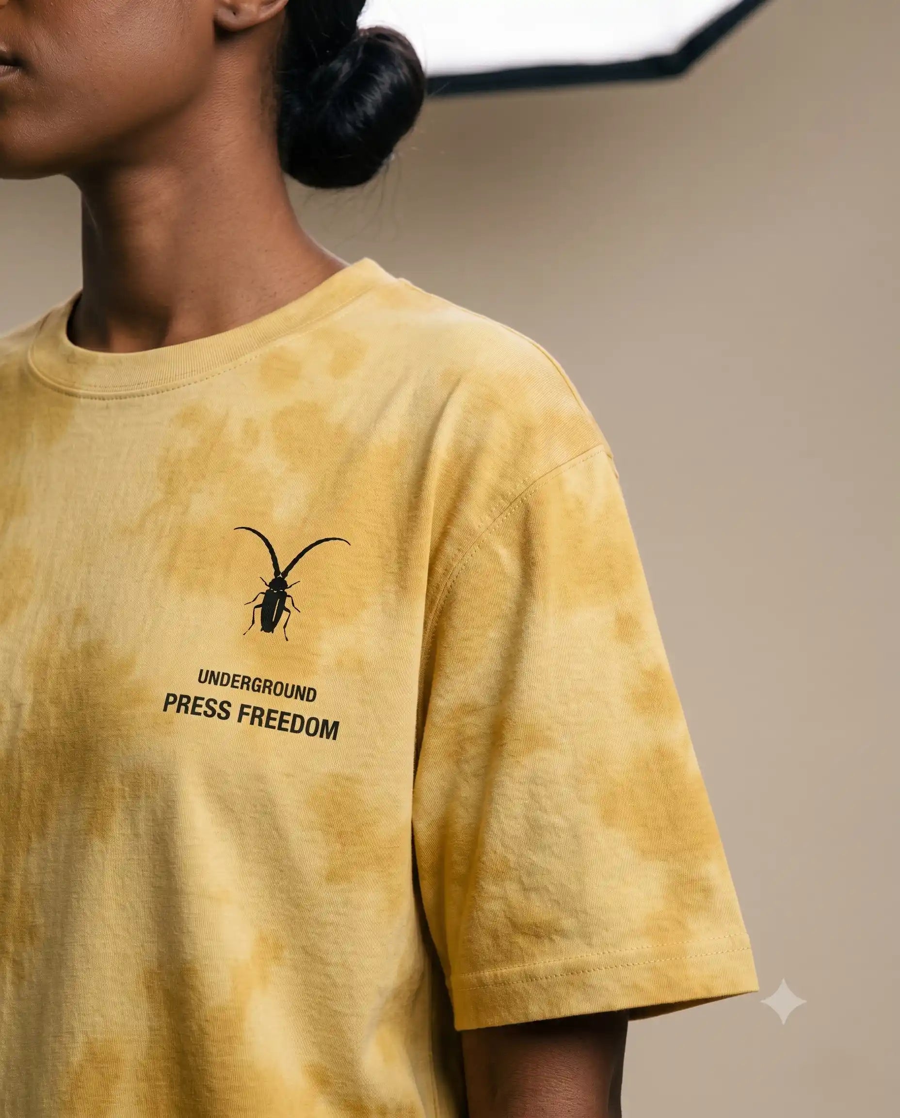 Front view of the Roach Resistance Press Freedom unisex oversized tie-dye t-shirt in bold yellow, crafted from heavy 260GSM cotton.